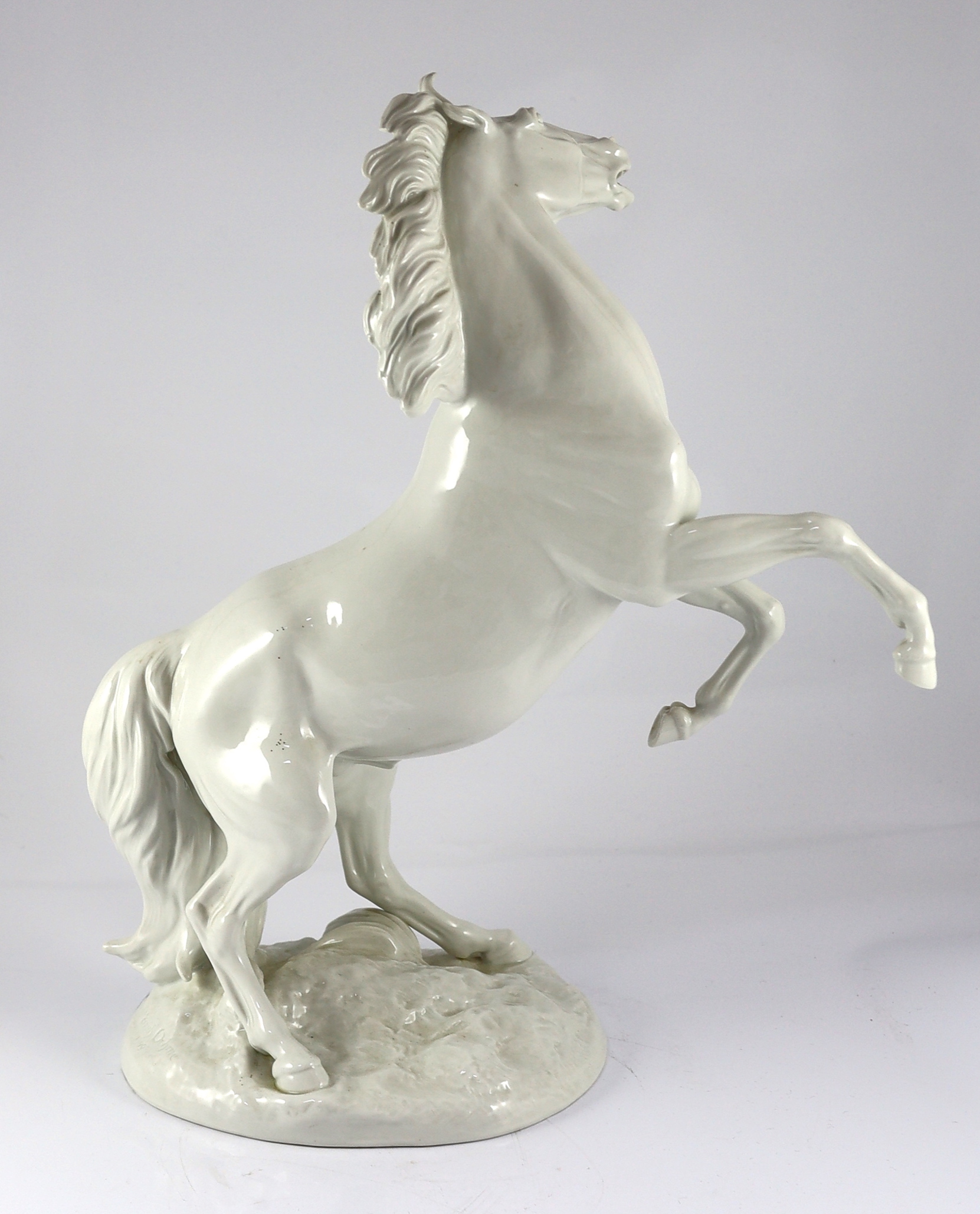 A large Meissen figure of a rearing stallion modelled by Eric Oehme, c.1949